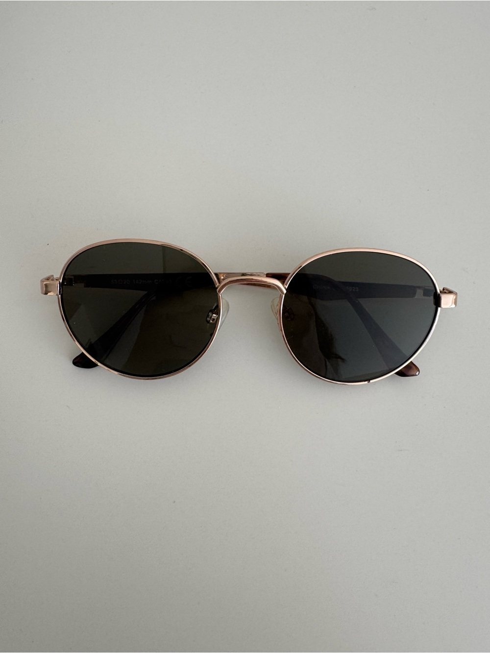 Round Metal Sunglasses in Rose Gold with Black Lenses